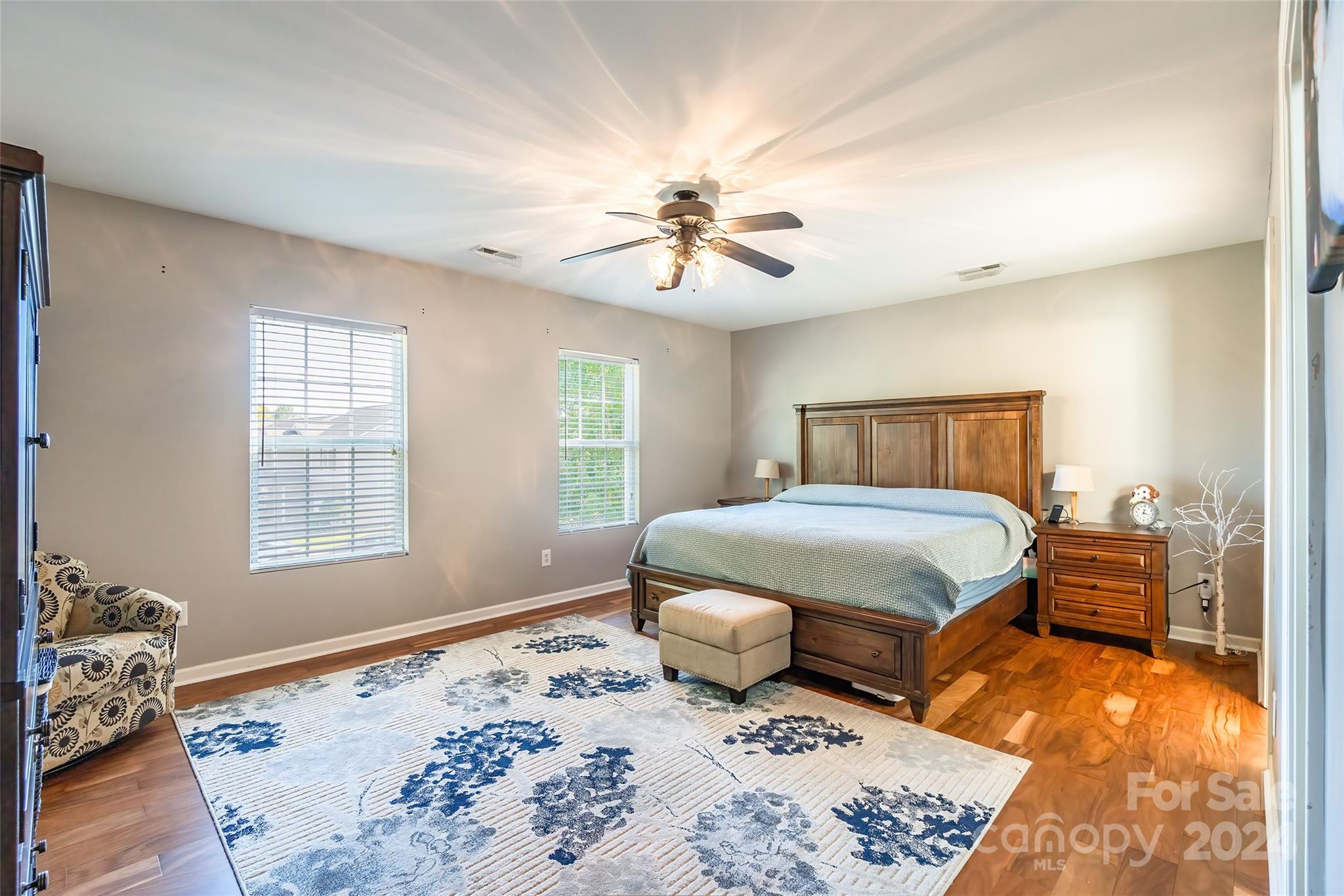 2901 Liddington Road Matthews, NC 28105 - Photo 18 of 37 a bedroom with a bed and wooden floor