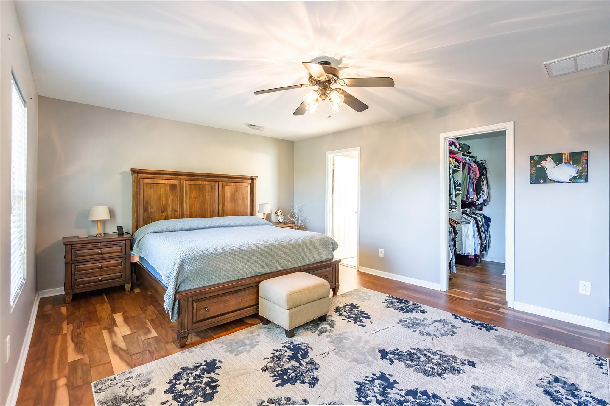 2901 Liddington Road Matthews, NC 28105 - Photo 19 of 37 a bedroom with a bed and wooden floor
