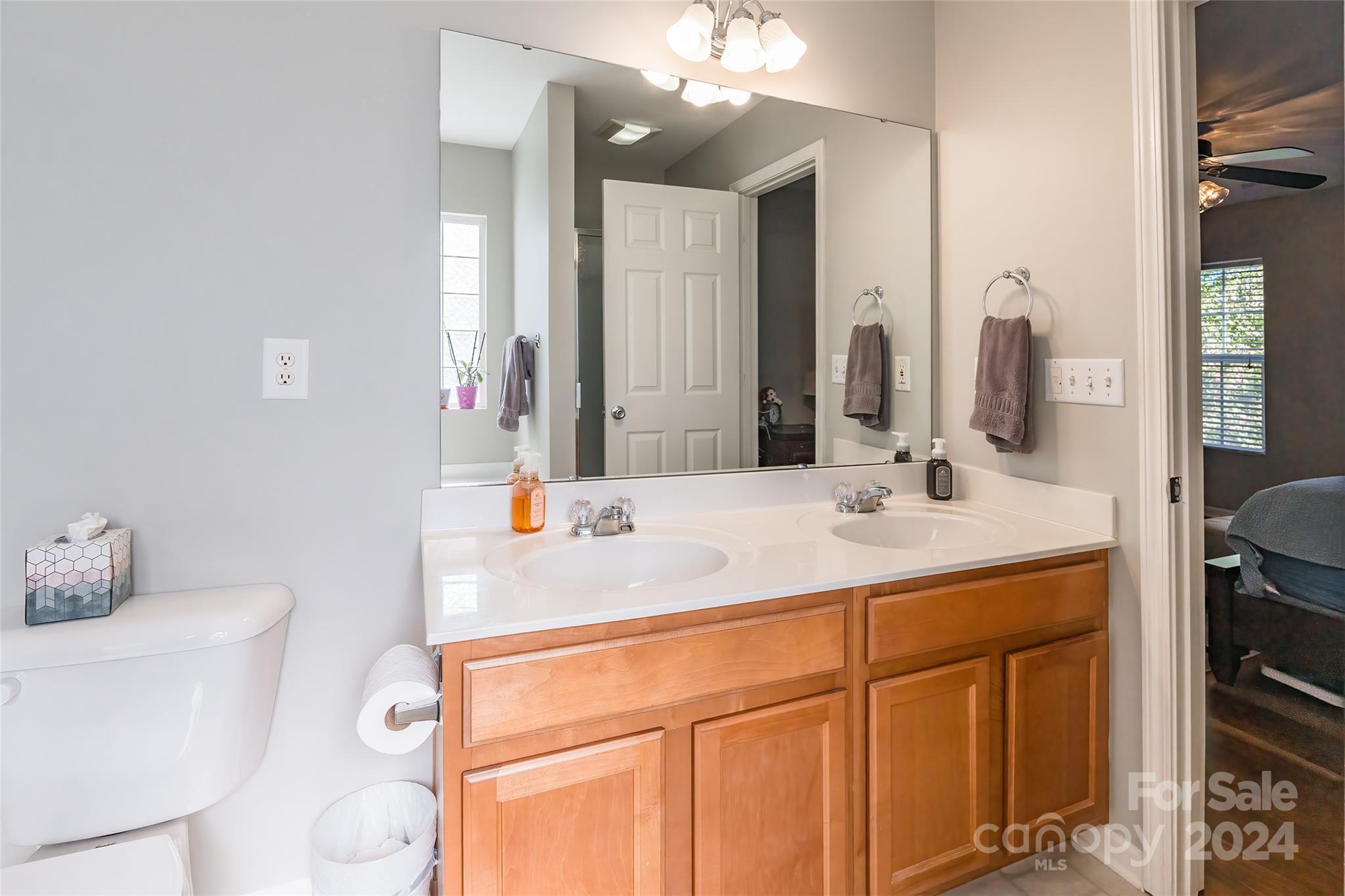 2901 Liddington Road Matthews, NC 28105 - Photo 22 of 37 a bathroom with a sink toilet vanity and shower