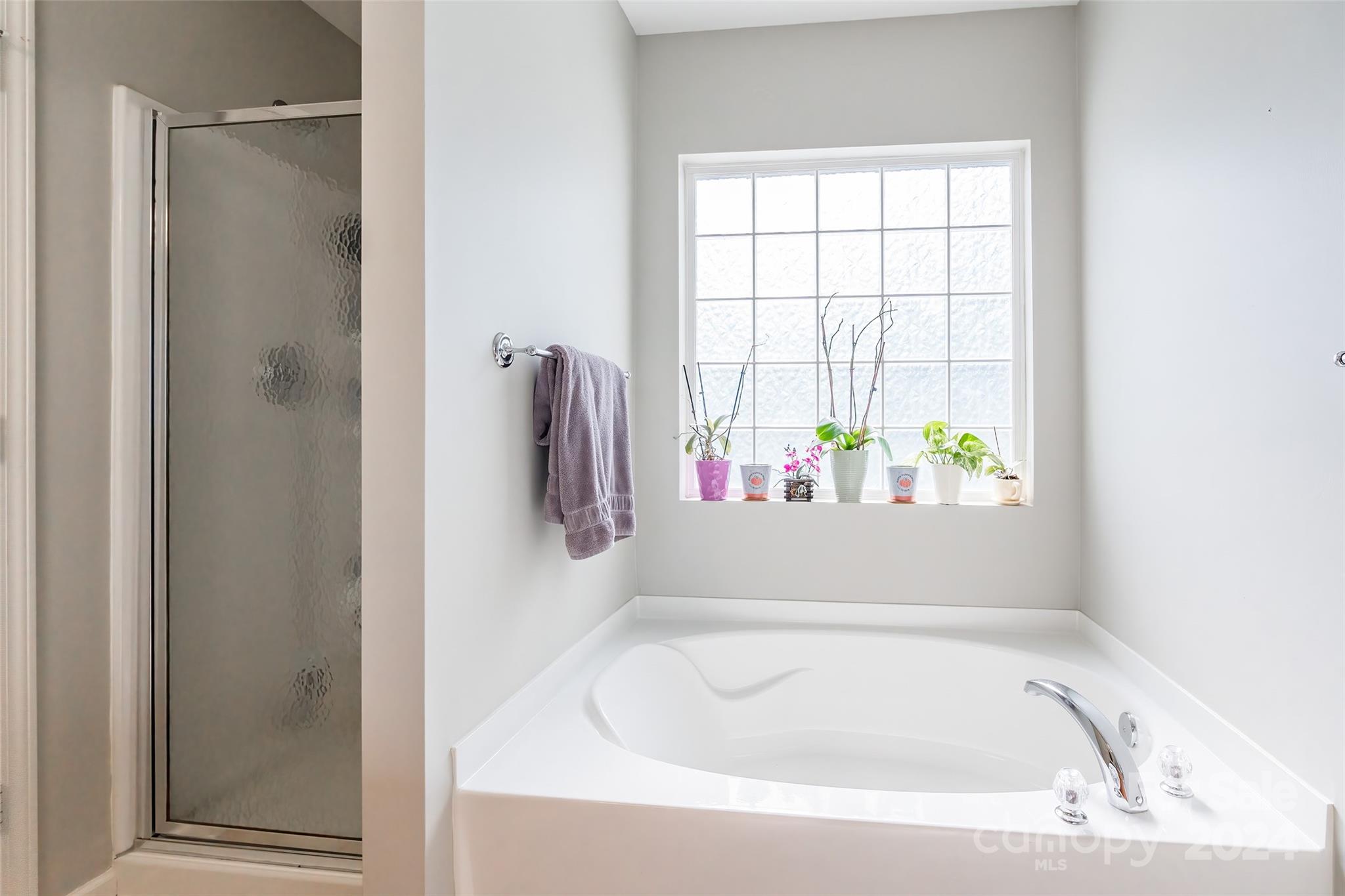 2901 Liddington Road Matthews, NC 28105 - Photo 23 of 37 a bathroom with a tub and shower