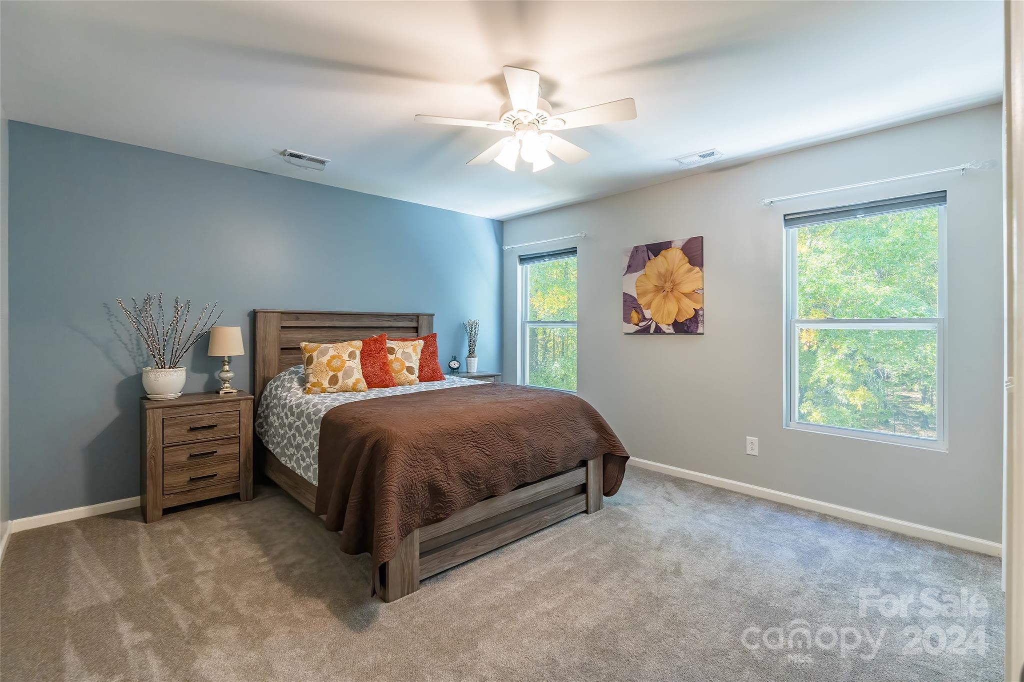 2901 Liddington Road Matthews, NC 28105 - Photo 24 of 37 a bedroom with a bed and a chandelier
