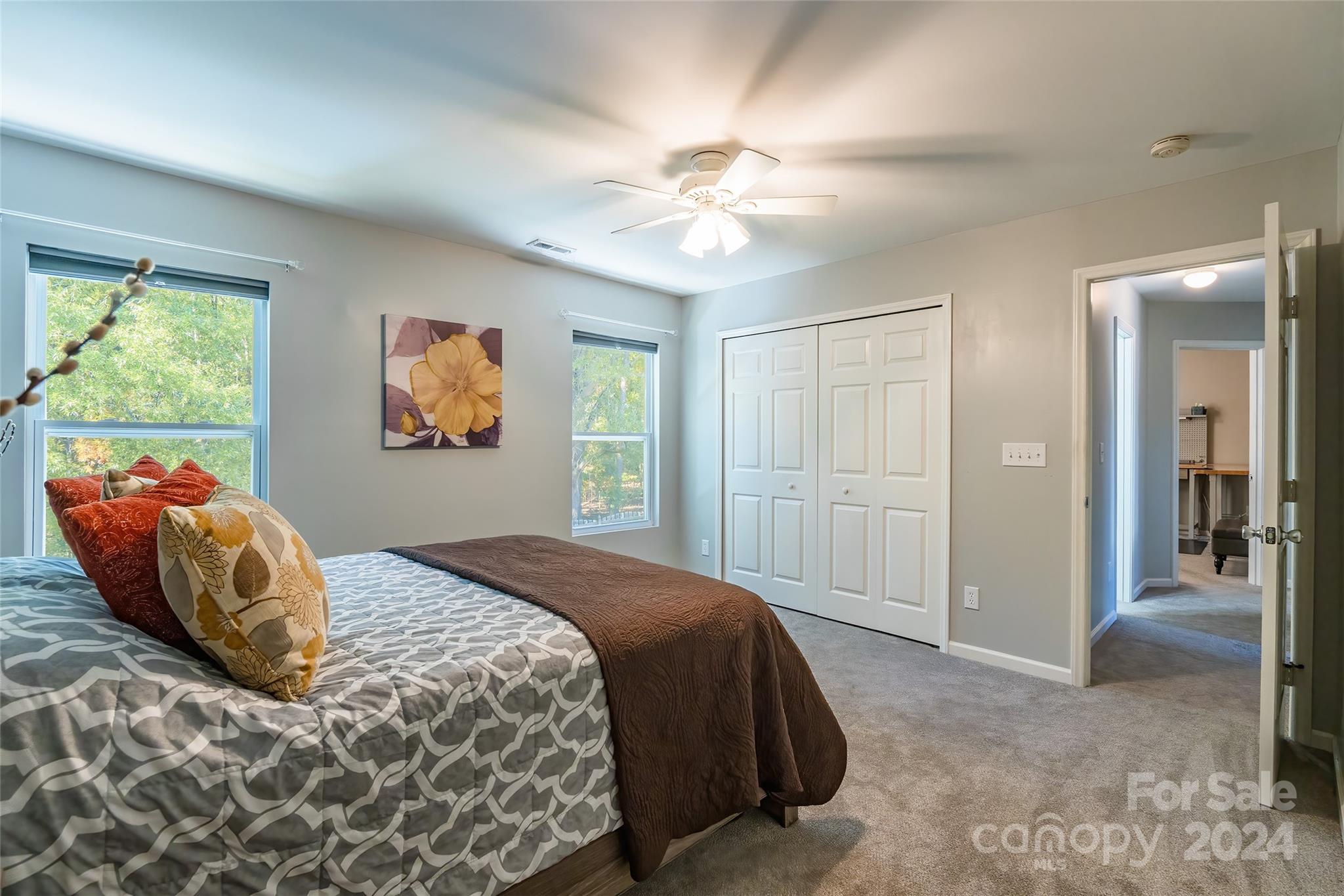 2901 Liddington Road Matthews, NC 28105 - Photo 25 of 37 a bedroom with a bed and a painting on the wall