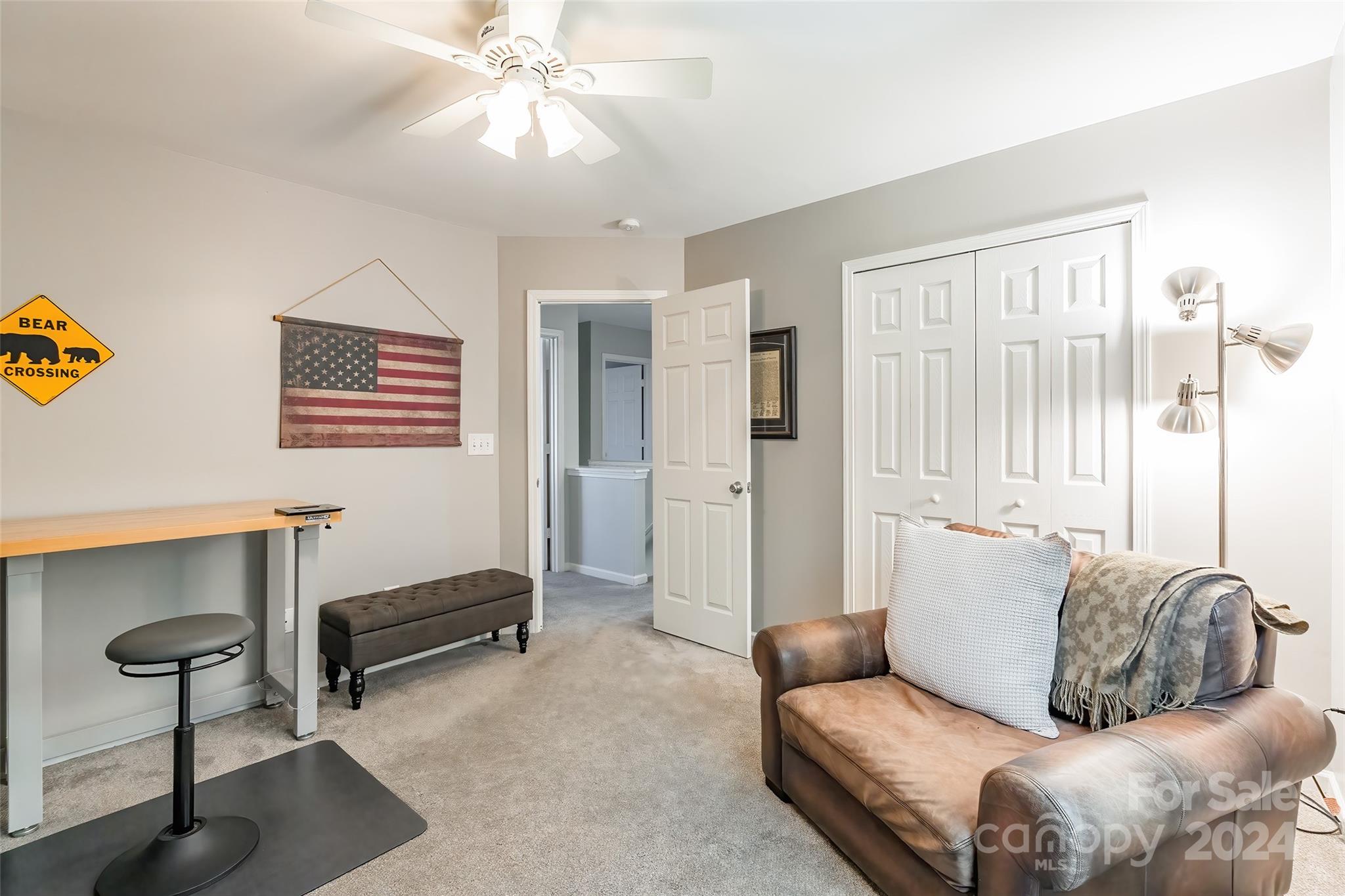 2901 Liddington Road Matthews, NC 28105 - Photo 27 of 37 a living room with furniture and a chandelier