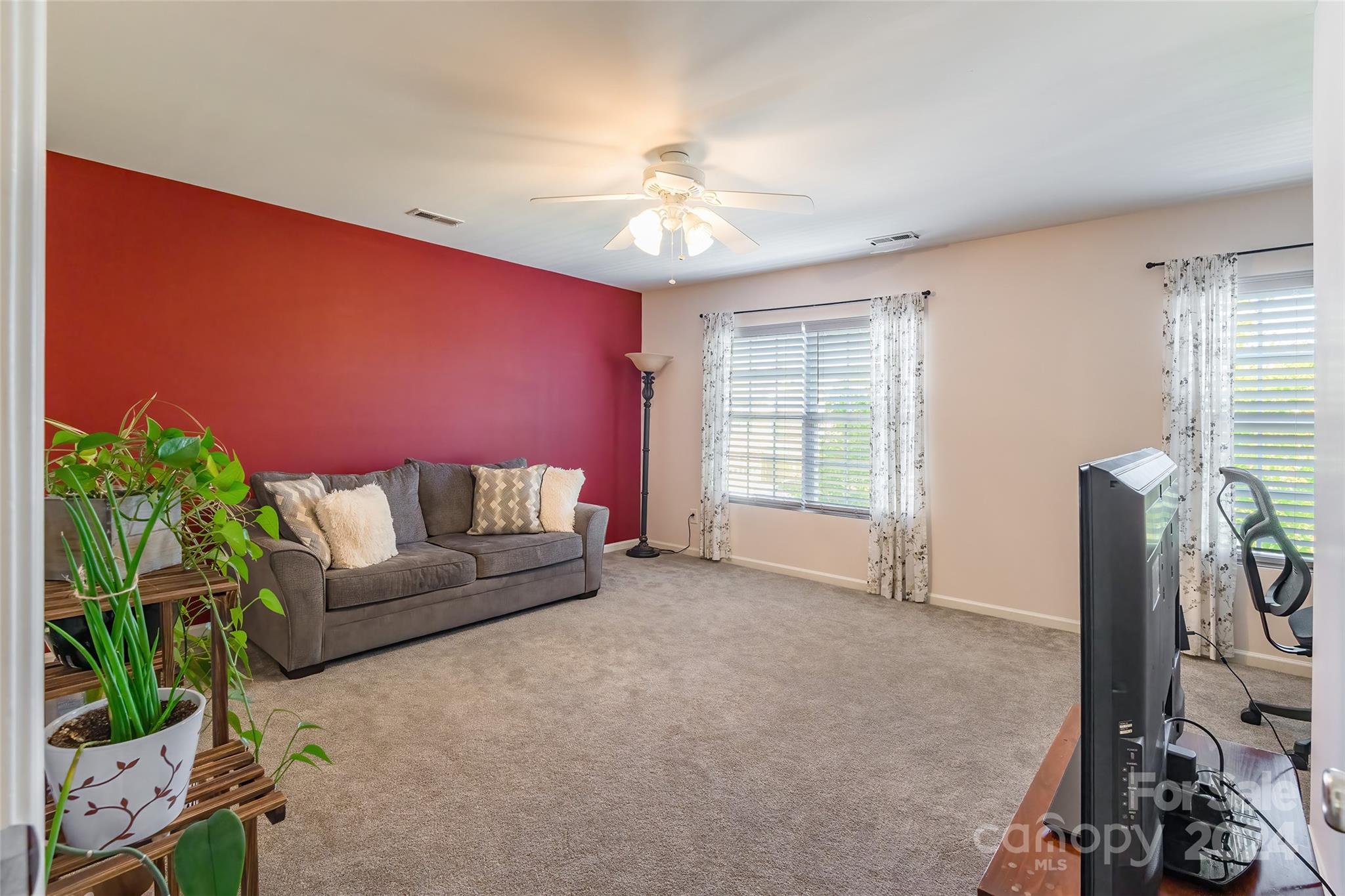 2901 Liddington Road Matthews, NC 28105 - Photo 28 of 37 a living room with furniture and a chandelier
