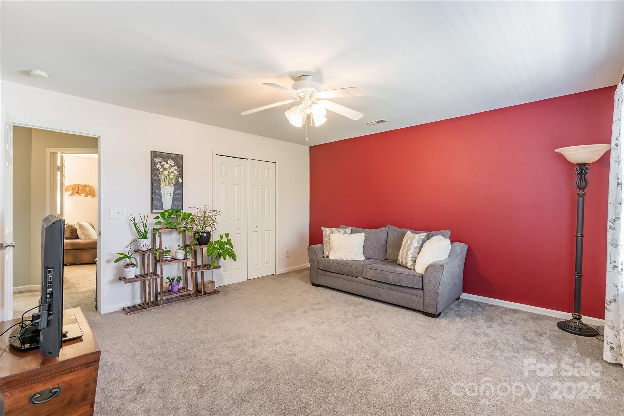 2901 Liddington Road Matthews, NC 28105 - Photo 29 of 37 a living room with furniture and a chandelier
