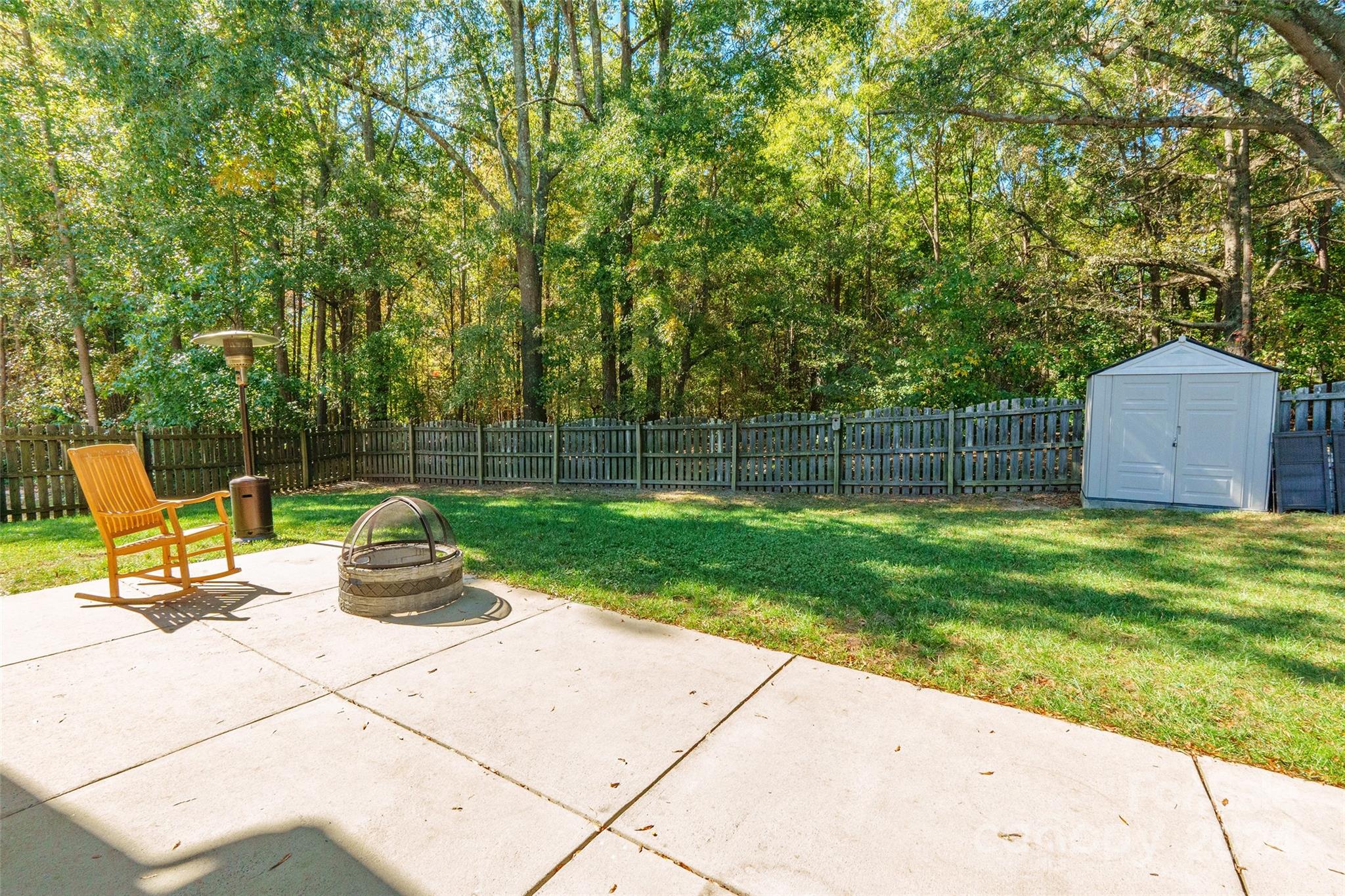2901 Liddington Road Matthews, NC 28105 - Photo 32 of 37 a view of a backyard with a bench and a slide