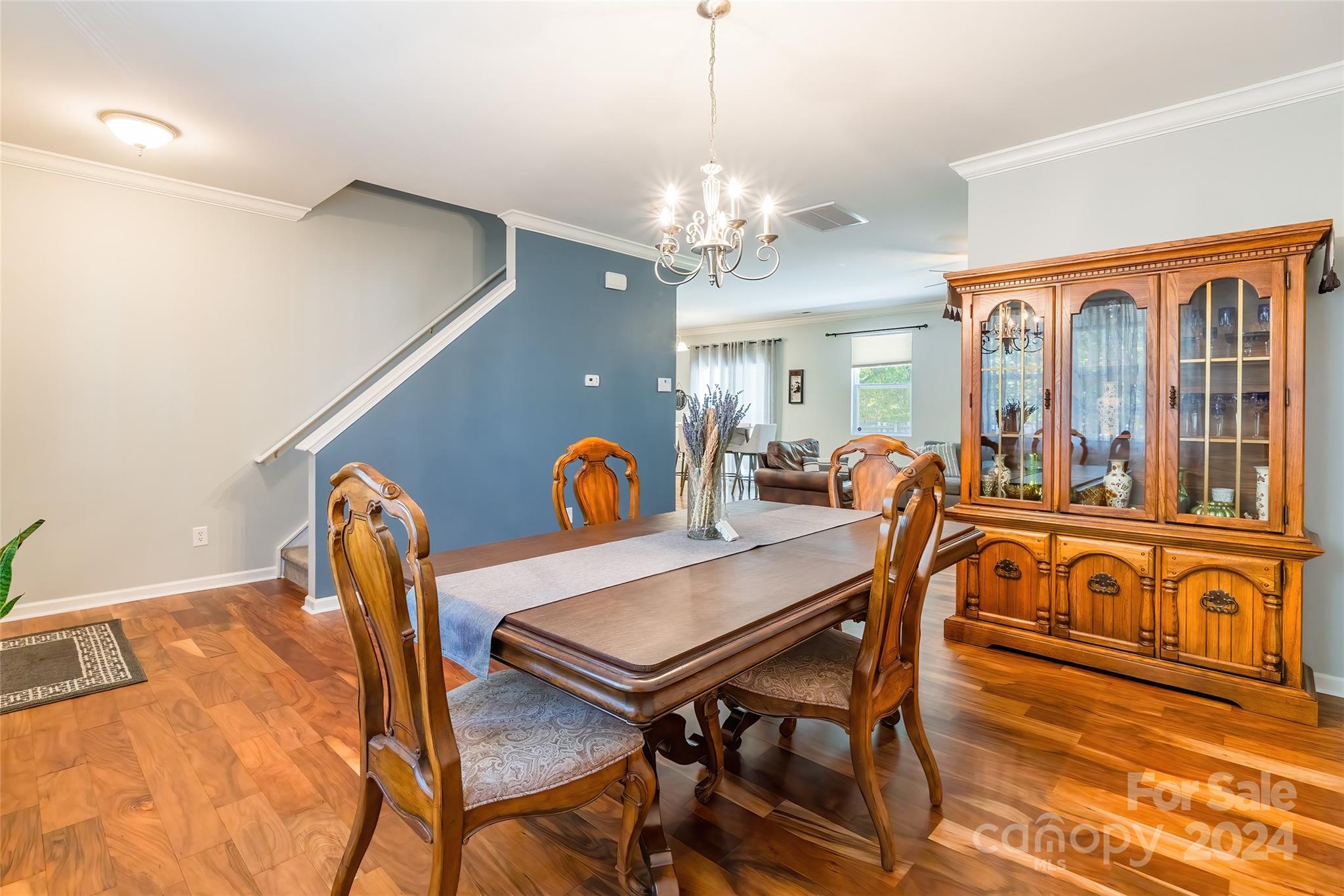 2901 Liddington Road Matthews, NC 28105 - Photo 6 of 37 a view of a dining room with furniture and a chandelier