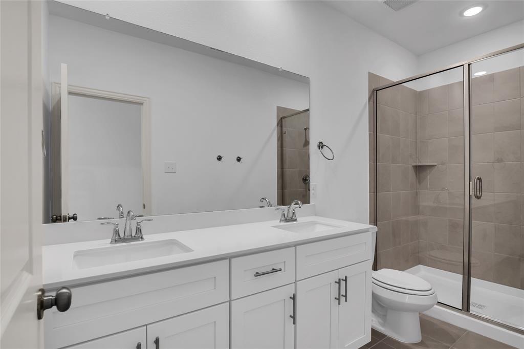 5258 Springlake Parkway Haltom City, TX 76117 - Photo 20 of 24 a bathroom with a sink toilet and shower