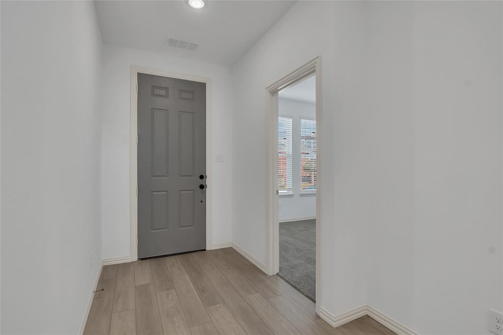 5258 Springlake Parkway Haltom City, TX 76117 - Photo 6 of 24 a view of an empty room with closet and mirror