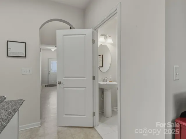 a kitchen with stainless steel appliances granite countertop a refrigerator stove a sink and microwave