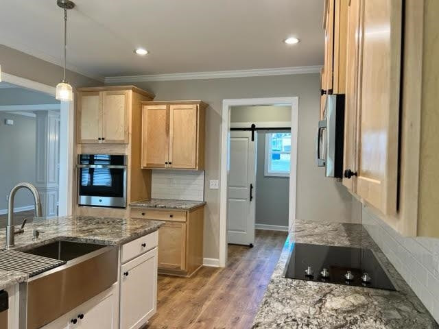 378 Lowery Lane Benson, NC 27504 - Photo 11 of 31 a kitchen with a sink and a refrigerator