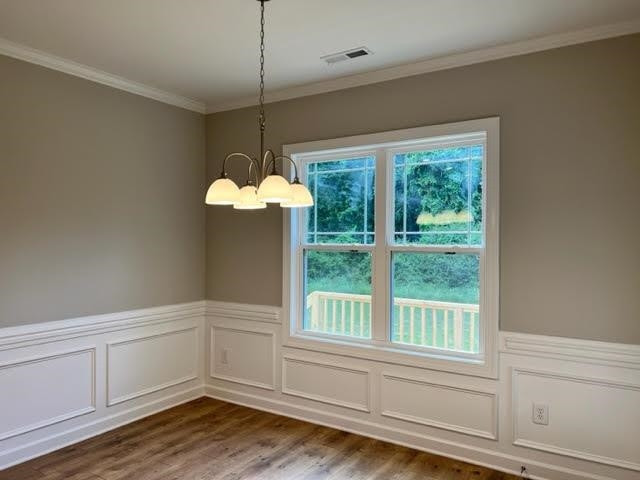 378 Lowery Lane Benson, NC 27504 - Photo 15 of 31 a view of a room with wooden floor and chandelier