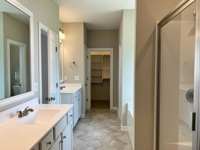 378 Lowery Lane Benson, NC 27504 - Photo 18 of 31 a bathroom with a double vanity sink mirror and shower