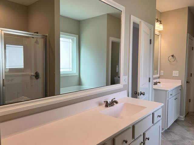 378 Lowery Lane Benson, NC 27504 - Photo 19 of 31 a bathroom with a sink and a mirror