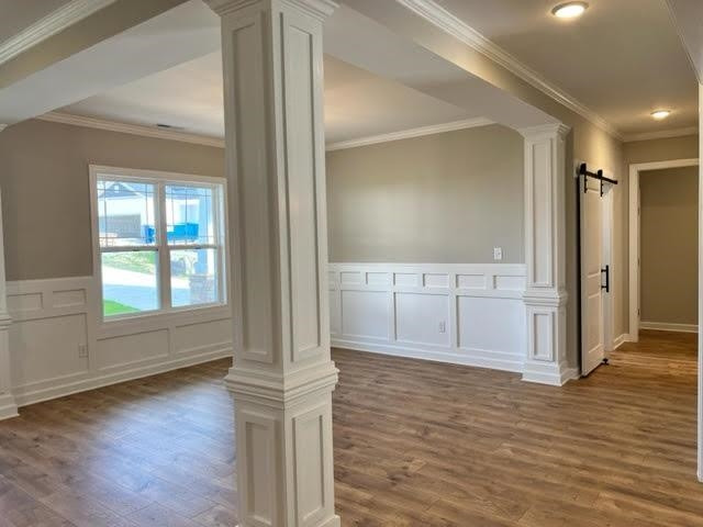 378 Lowery Lane Benson, NC 27504 - Photo 4 of 31 an empty room with wooden floor and windows