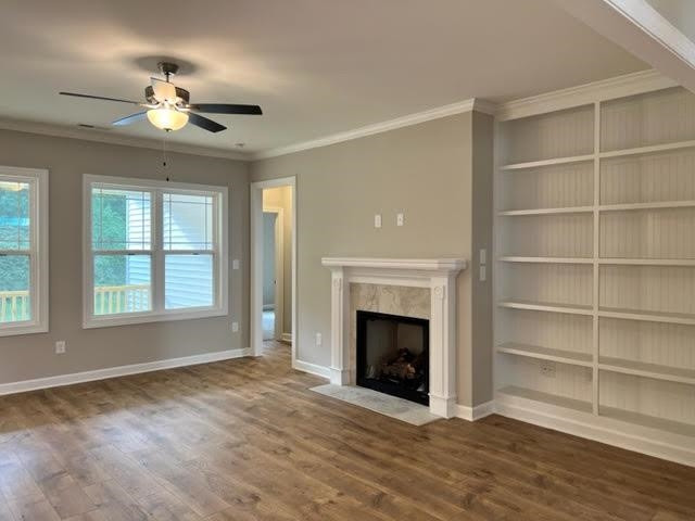 378 Lowery Lane Benson, NC 27504 - Photo 8 of 31 a view of an empty room with a fireplace and a window