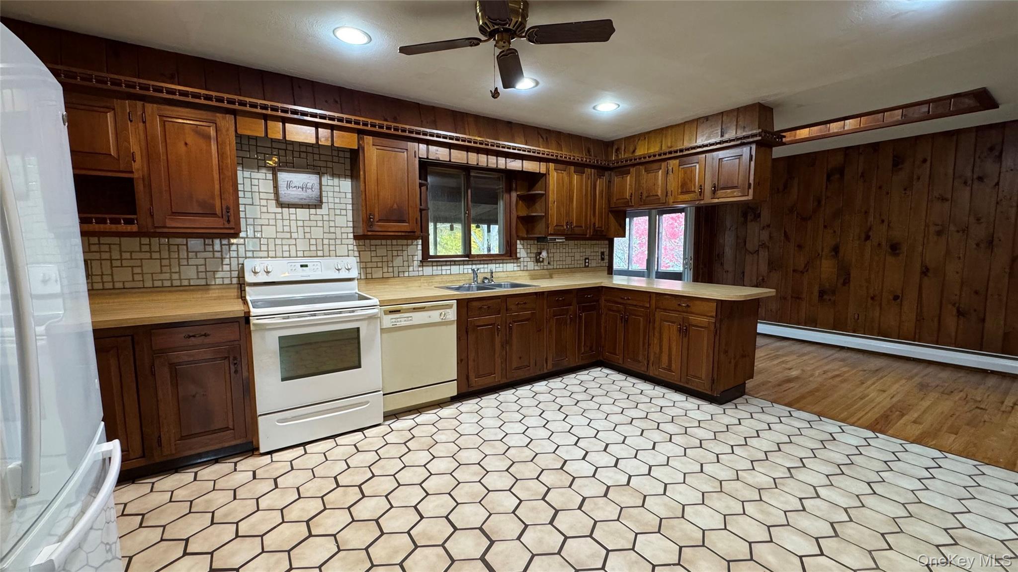 107 Noxon Road Poughkeepsie, NY 12603 - Photo 12 of 38 a kitchen with a sink appliances and cabinets