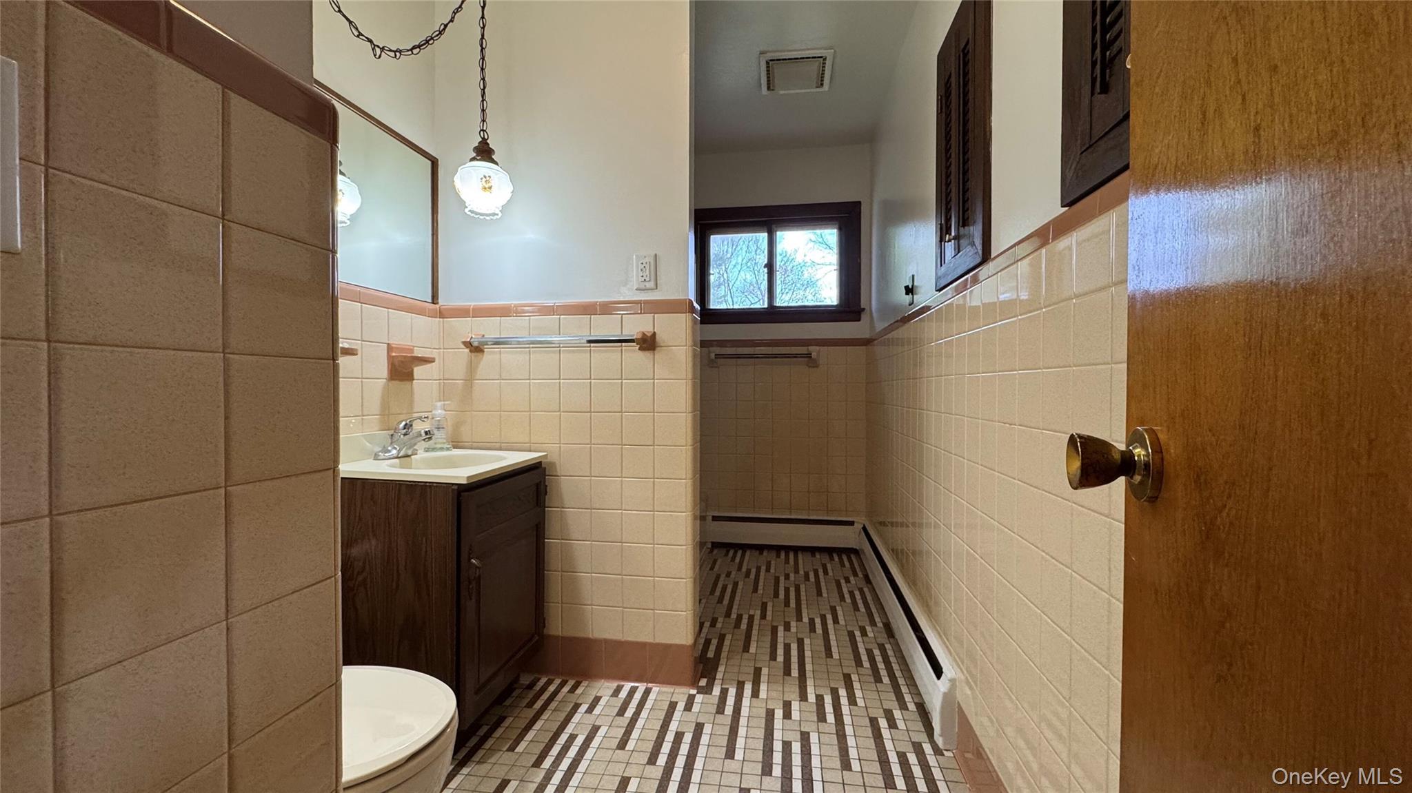 107 Noxon Road Poughkeepsie, NY 12603 - Photo 17 of 38 a bathroom with a sink and mirror