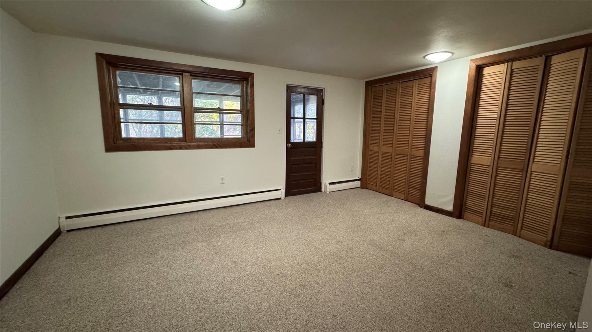 107 Noxon Road Poughkeepsie, NY 12603 - Photo 28 of 38 an empty room with windows