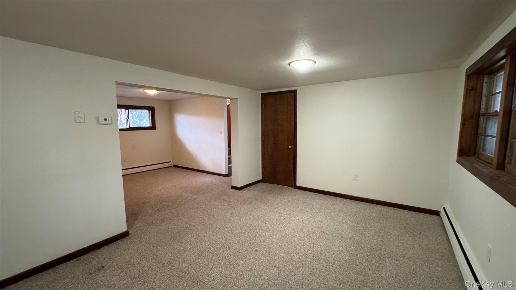 107 Noxon Road Poughkeepsie, NY 12603 - Photo 29 of 38 an empty room with windows