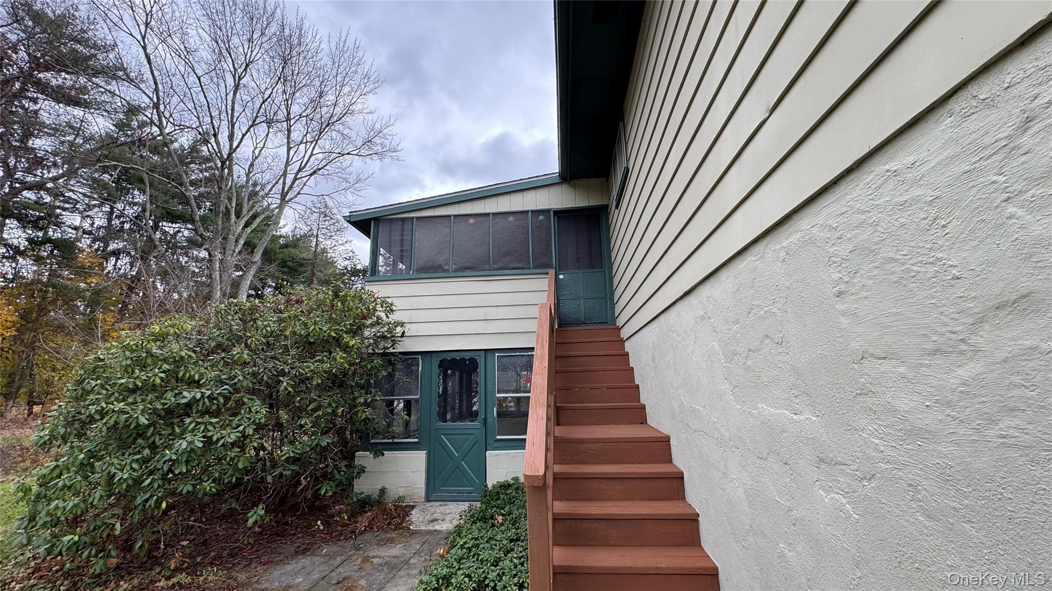 107 Noxon Road Poughkeepsie, NY 12603 - Photo 34 of 38 a view of a house with a staircase