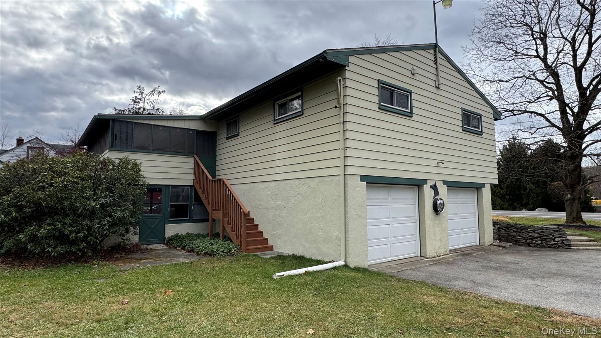 107 Noxon Road Poughkeepsie, NY 12603 - Photo 35 of 38 a view of a house with a yard