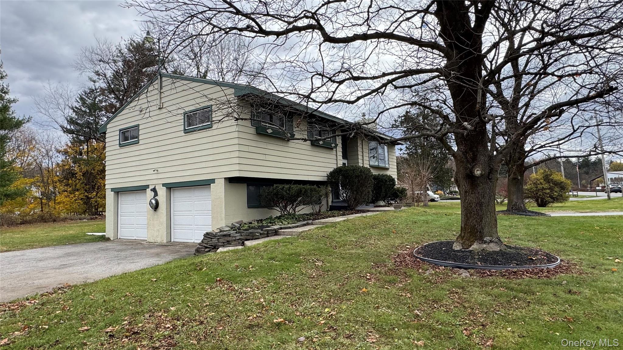 107 Noxon Road Poughkeepsie, NY 12603 - Photo 5 of 38 a front view of a house with garden