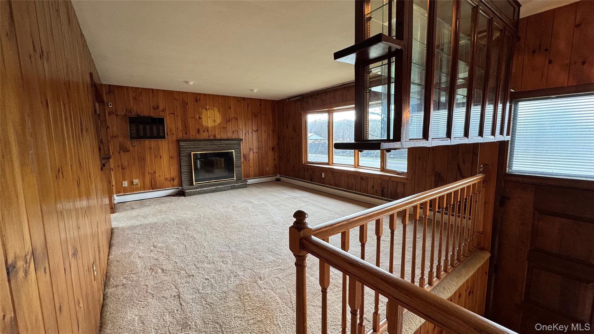 107 Noxon Road Poughkeepsie, NY 12603 - Photo 9 of 38 a view of an empty room with wooden floor and a window