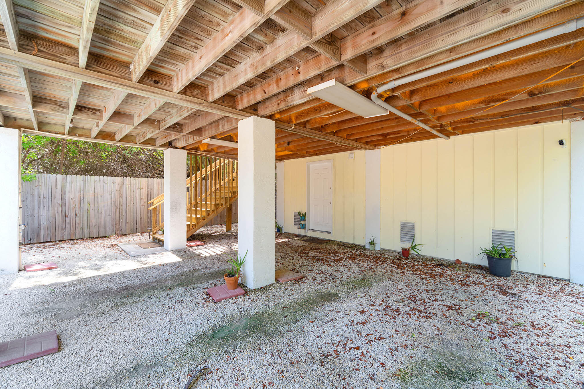 29951 Pine Channel Road Big Pine Key, FL 33043 - Photo 54 of 61 a backyard with wooden fence and large windows