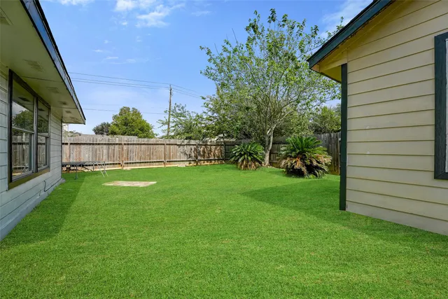 a view of yard with seating area and garden