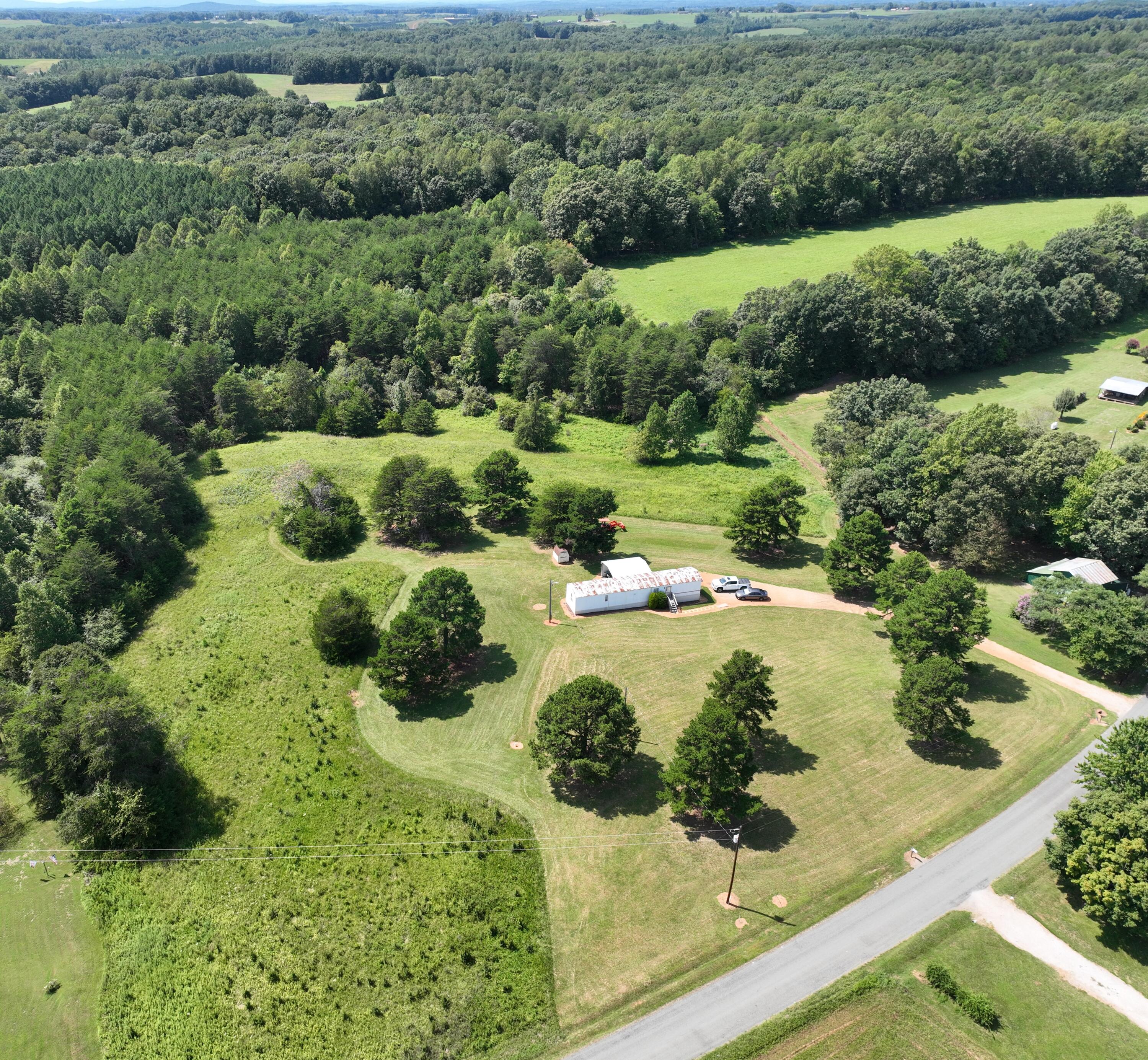 1494 Green Bay Road Chatham, VA 24531 - Photo 1 of 54 a view of a garden with a fountain