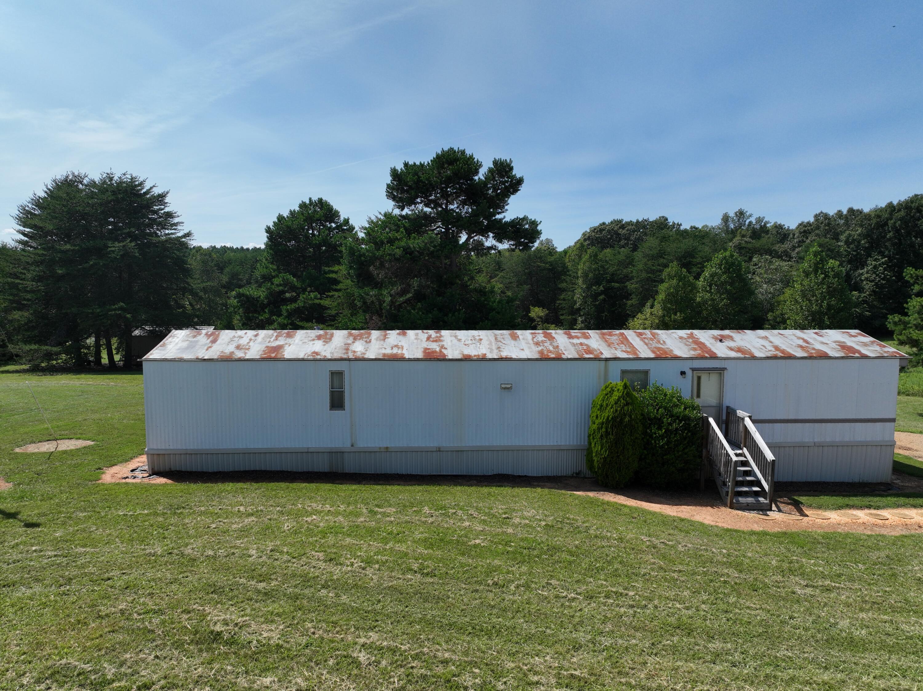 1494 Green Bay Road Chatham, VA 24531 - Photo 23 of 54 a view of a table and chairs in the garden