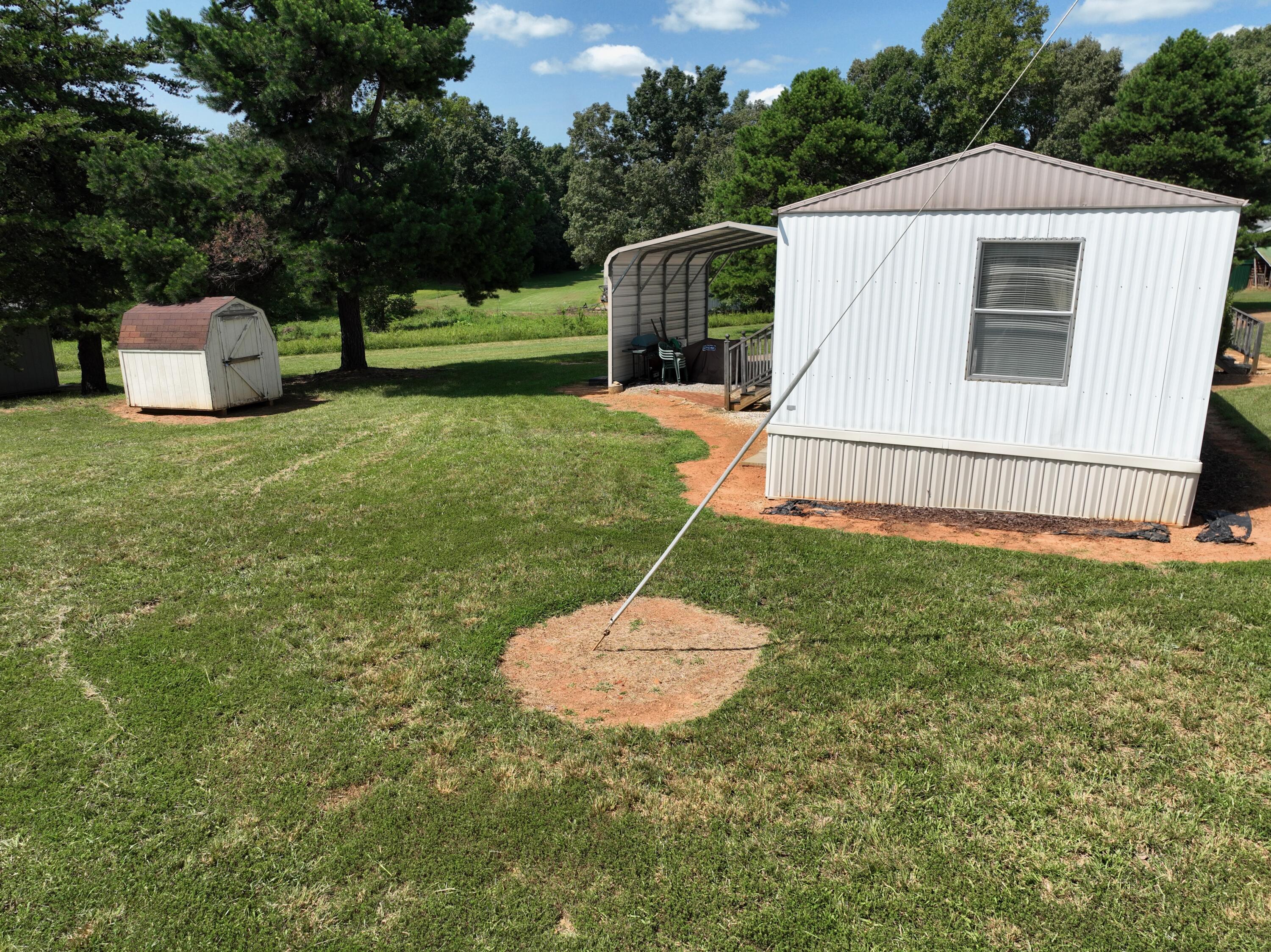 1494 Green Bay Road Chatham, VA 24531 - Photo 25 of 54 a backyard of a house with table and chairs