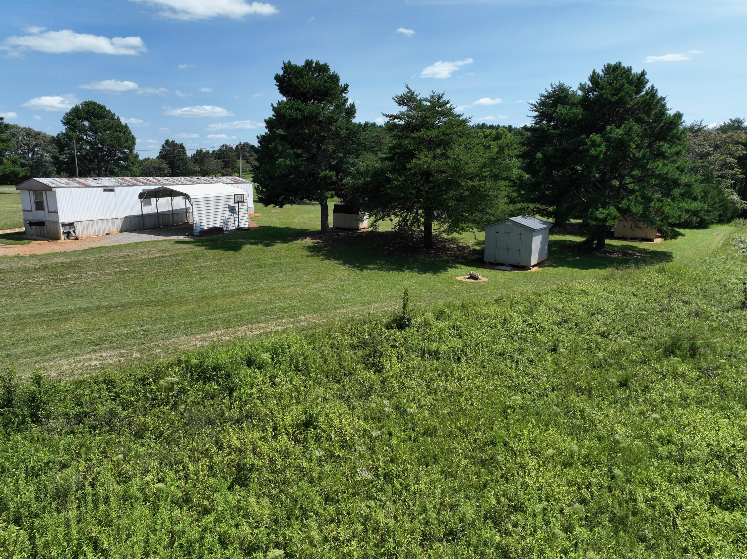 1494 Green Bay Road Chatham, VA 24531 - Photo 28 of 54 a front view of a house with a garden