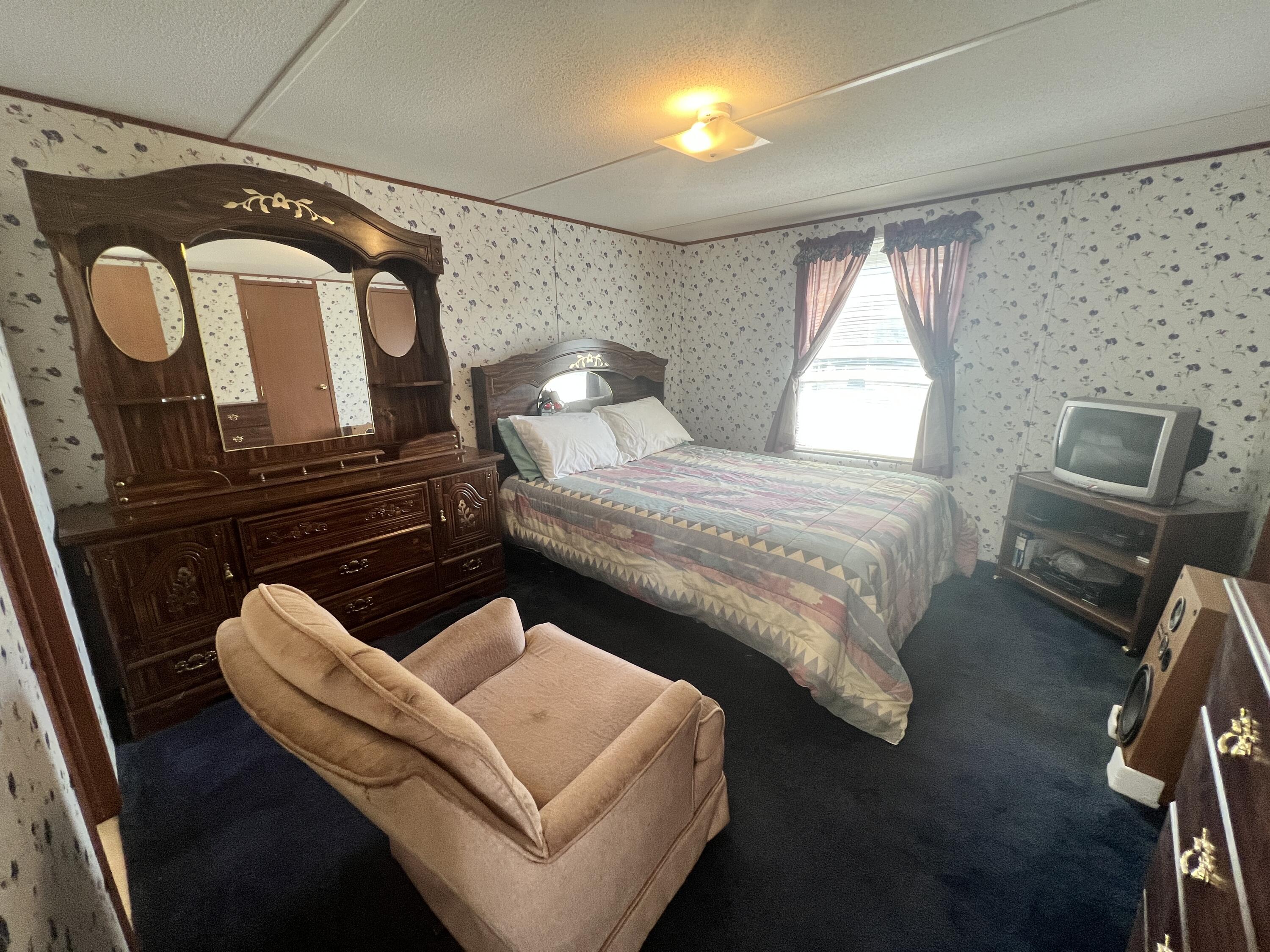 1494 Green Bay Road Chatham, VA 24531 - Photo 50 of 54 a bedroom with bed and wooden floor