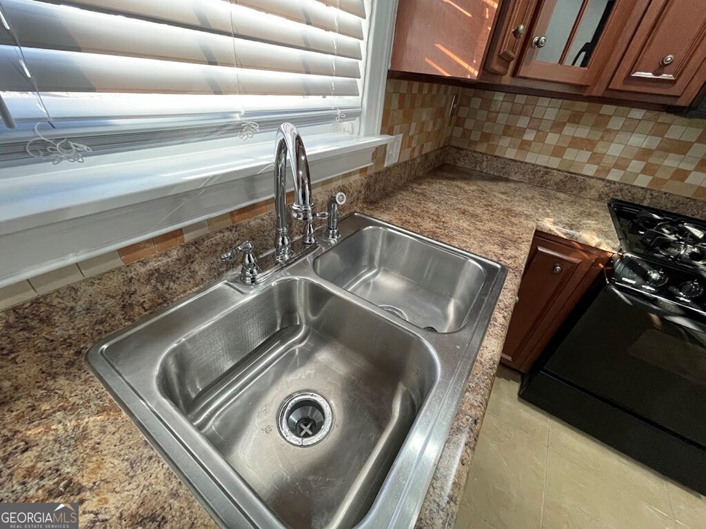 2311 St George Lane Albany, GA 31707 - Photo 16 of 39 a close view of sink and stove