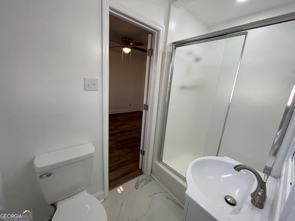 2311 St George Lane Albany, GA 31707 - Photo 20 of 39 a bathroom with a sink toilet and shower
