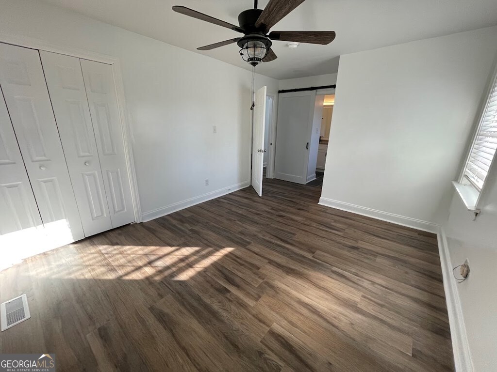 2311 St George Lane Albany, GA 31707 - Photo 25 of 39 a view of a livingroom with a chandelier fan and wooden floor