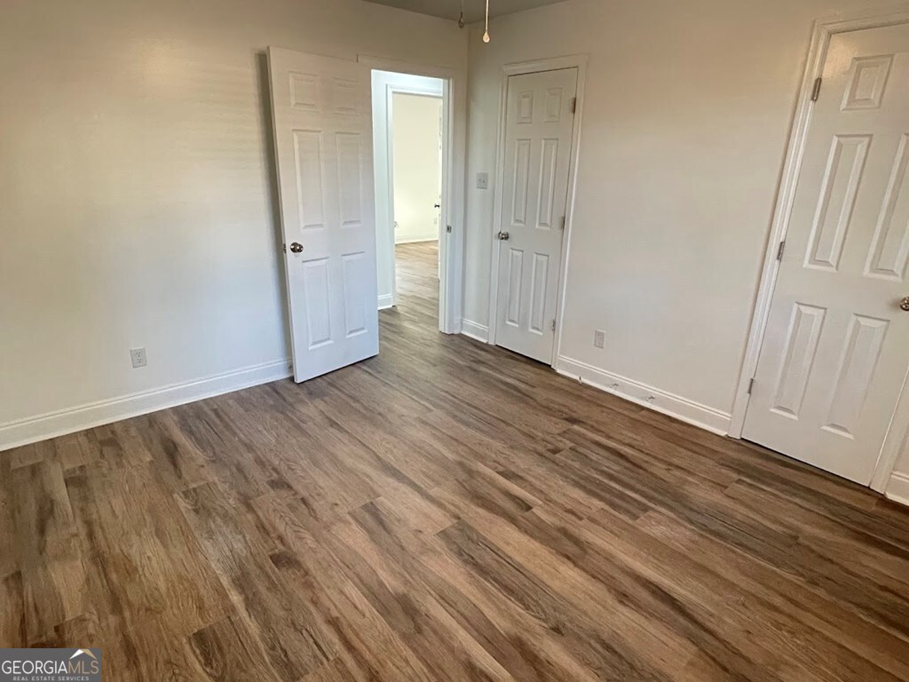 2311 St George Lane Albany, GA 31707 - Photo 34 of 39 a view of an empty room with wooden floor and a window