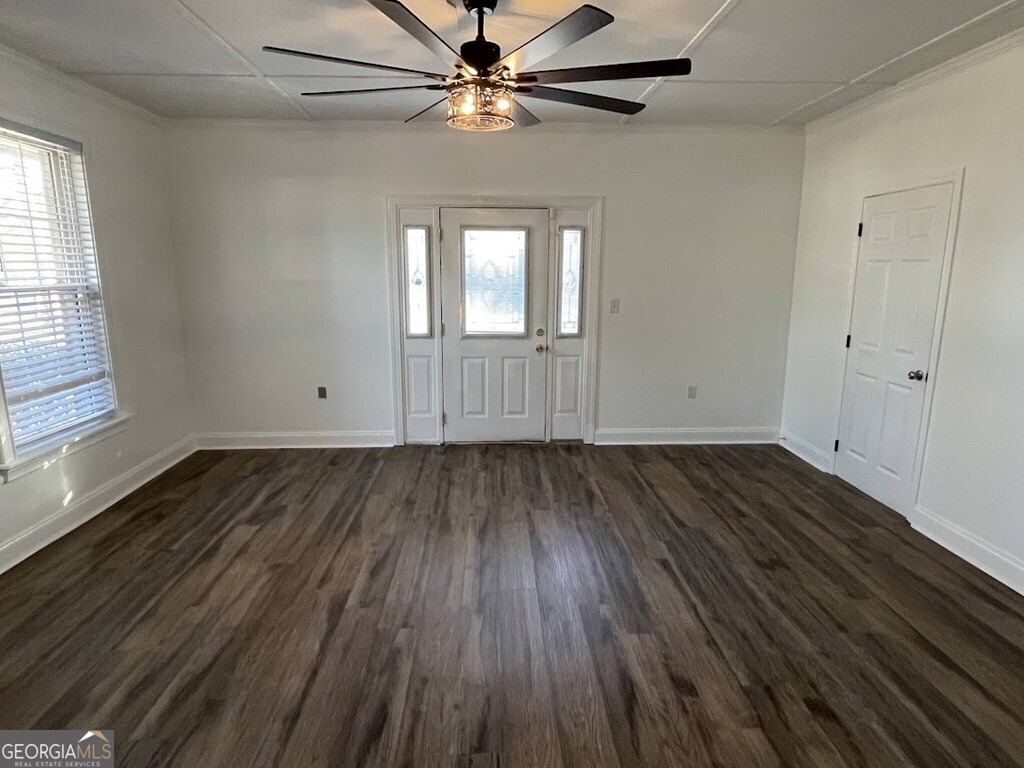2311 St George Lane Albany, GA 31707 - Photo 37 of 39 wooden floor in an empty room with a window