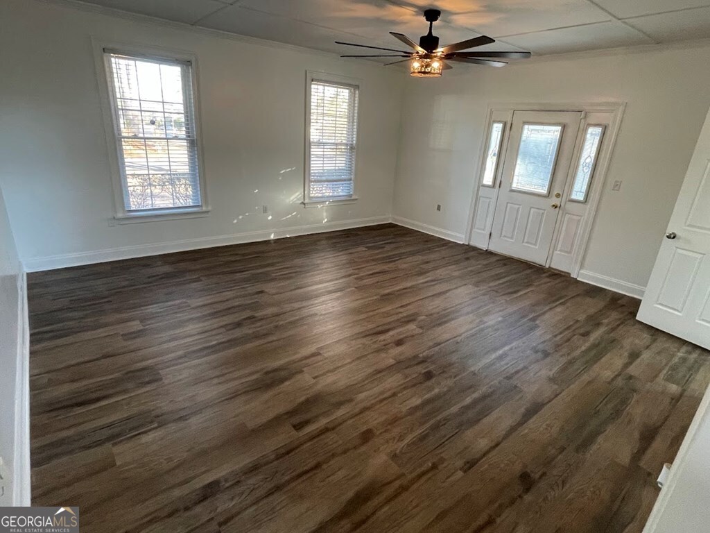 2311 St George Lane Albany, GA 31707 - Photo 38 of 39 a view of an empty room with wooden floor and a window