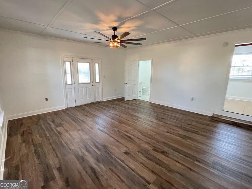 2311 St George Lane Albany, GA 31707 - Photo 39 of 39 wooden floor in an empty room with a window