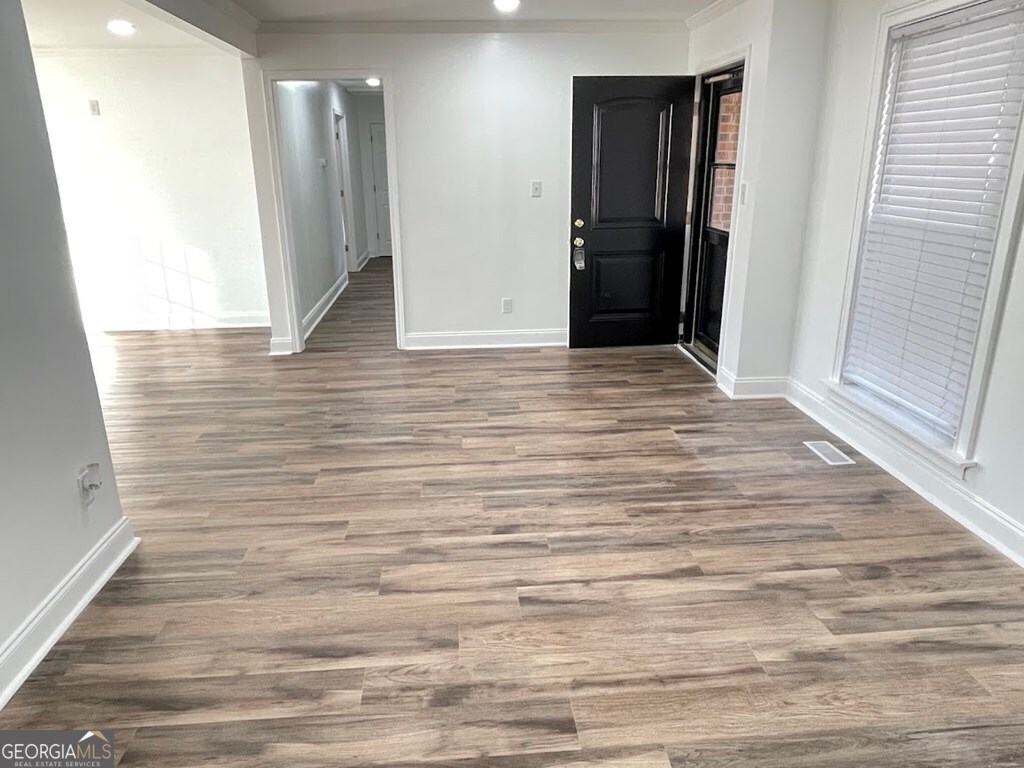 2311 St George Lane Albany, GA 31707 - Photo 4 of 39 a view of hallway with wooden floor