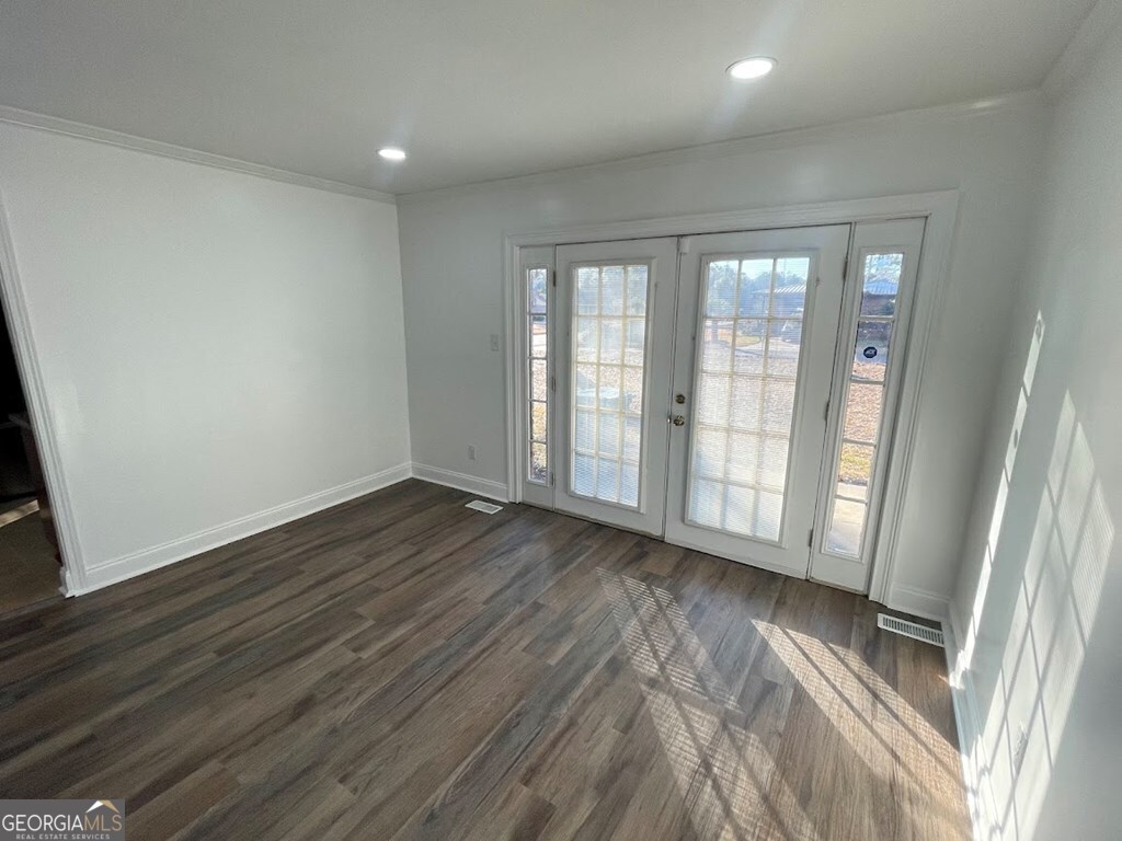 2311 St George Lane Albany, GA 31707 - Photo 7 of 39 a view of an empty room with wooden floor and a window