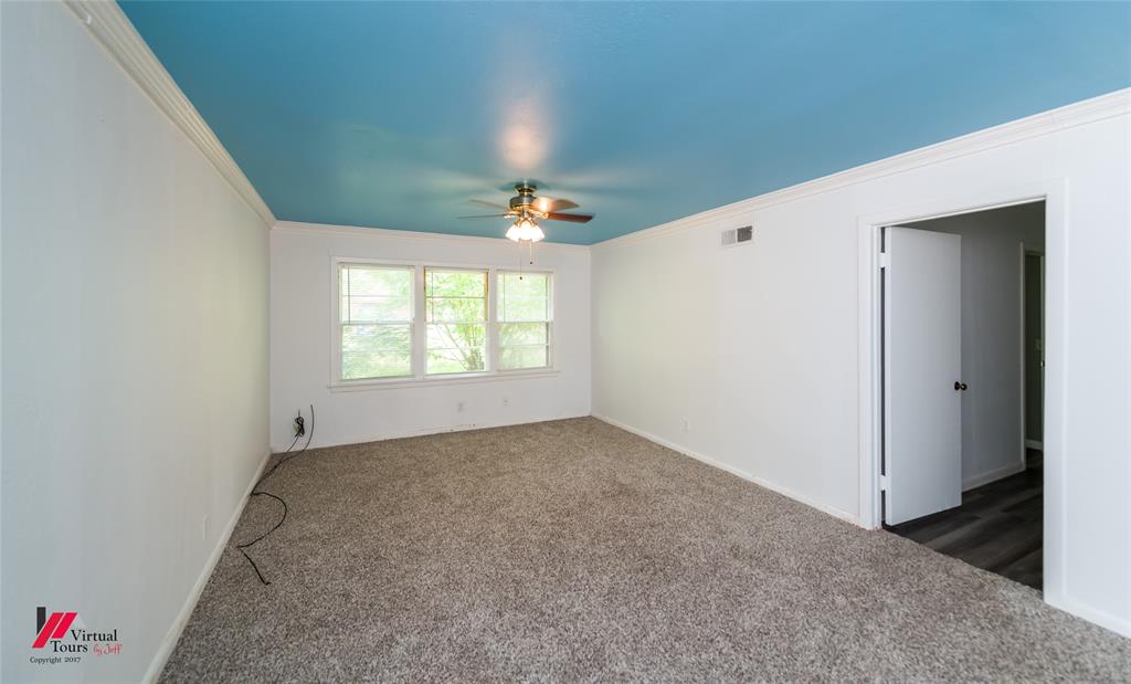 3109 Gorton Road Shreveport, LA 71119 - Photo 8 of 31 an empty room with windows and chandelier fan