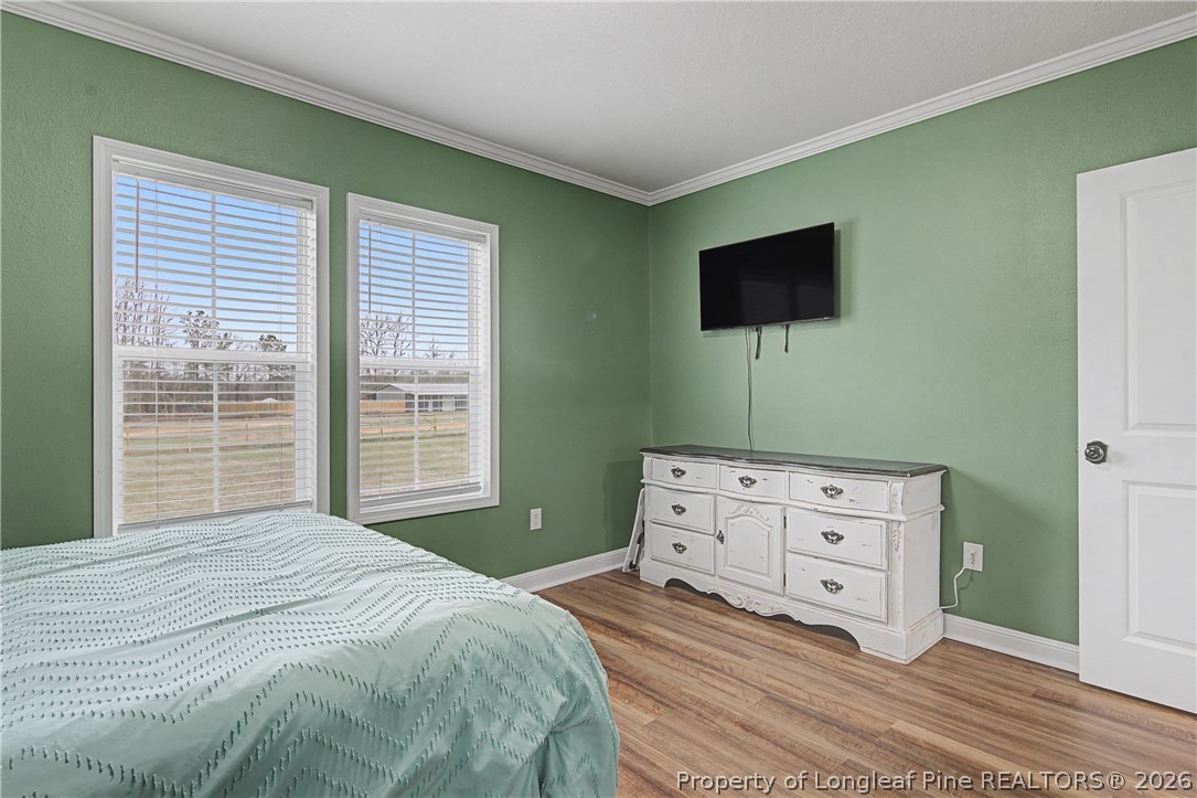 9109 Chicken Foot Road St. Pauls, NC 28384 - Photo 34 of 50 a bedroom with a bed and a flat screen tv