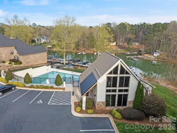 an aerial view of a house with a backyard