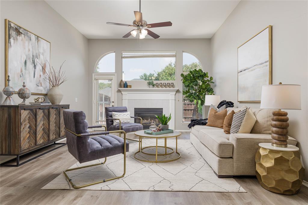 3313 Heatherbrook Drive Plano, TX 75074 - Photo 1 of 1 a living room with furniture a fireplace and a chandelier