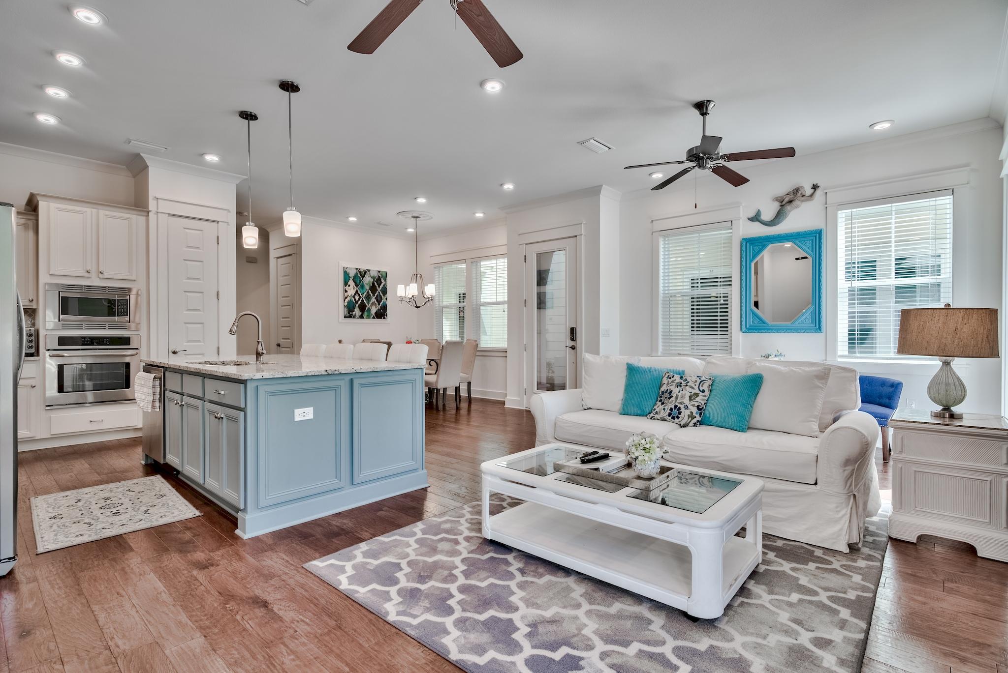18 Milestone Drive Inlet Beach, Unit A Inlet Beach, FL 32461 - Photo 1 of 39 a living room with furniture a rug and kitchen view