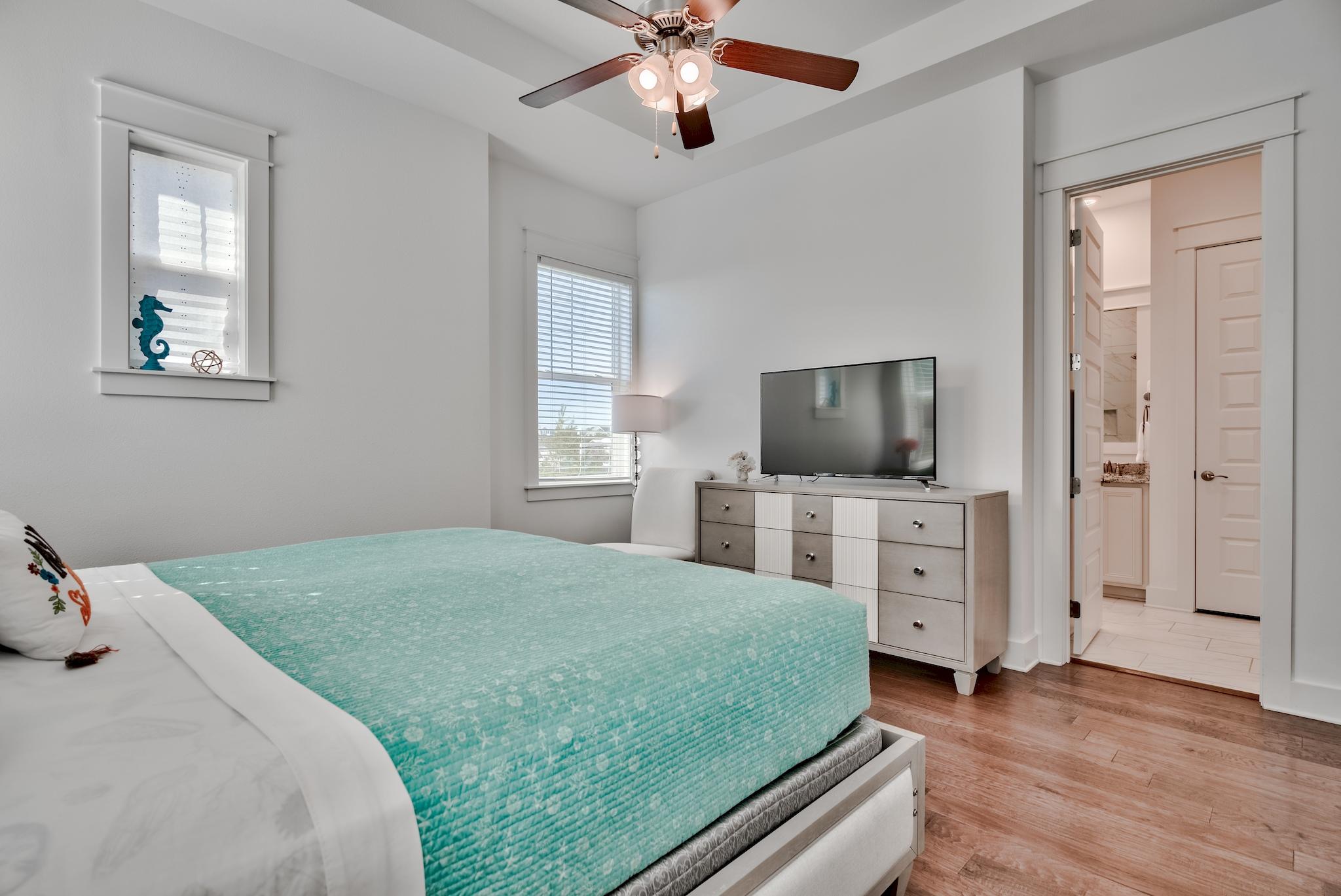 18 Milestone Drive Inlet Beach, Unit A Inlet Beach, FL 32461 - Photo 11 of 39 a bedroom with a bed and a flat screen tv